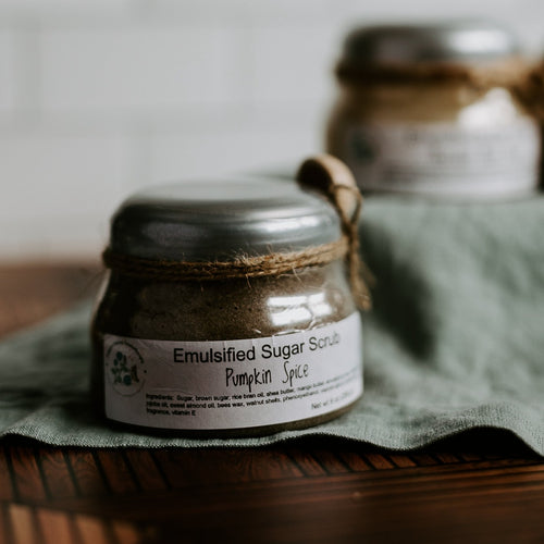 Pumpkin spice scented emulsified sugar scrub from Nature's Kisses Aromatherapy on a wooden background