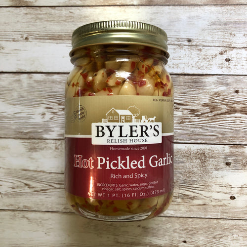 Can of Byler's hot pickled garlic on a wooden background