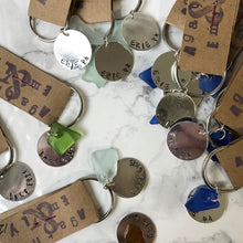 Load image into Gallery viewer, Pile of the Agatha and Emily Erie Beach Glass keychain
